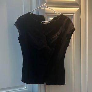 Black fitted zip in back shell with chain and pearl detail